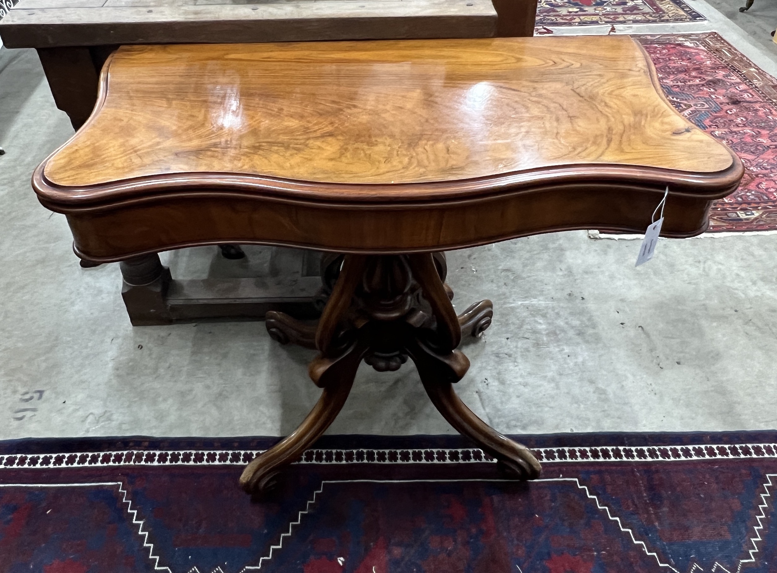 A Victorian mahogany serpentine card table, width 90cm, depth 45cm, height 73cm